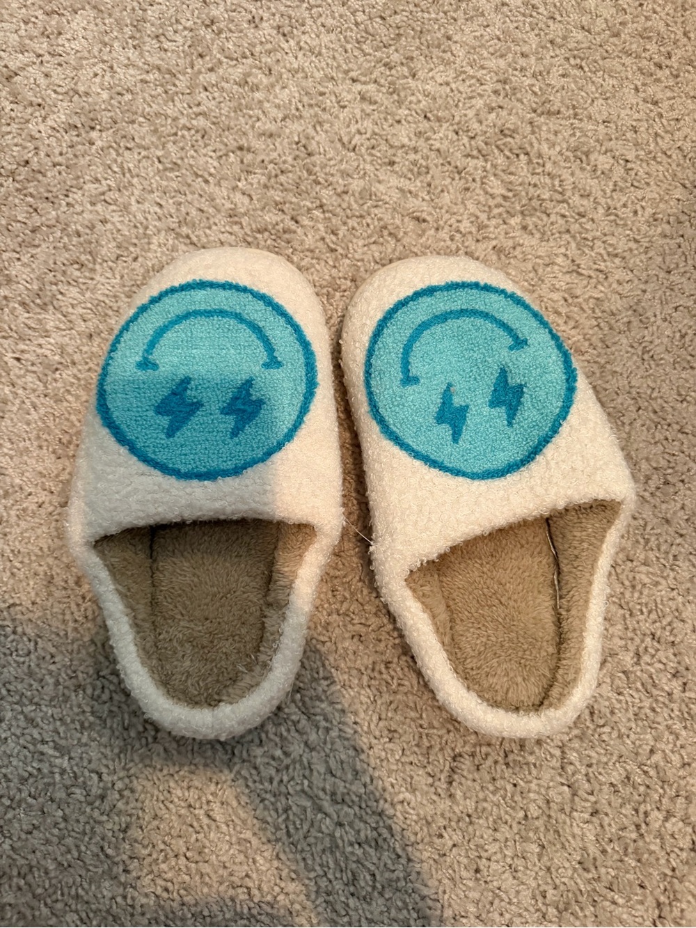 Cream Cozy Slip-On Slippers with Blue Lightning Emblem